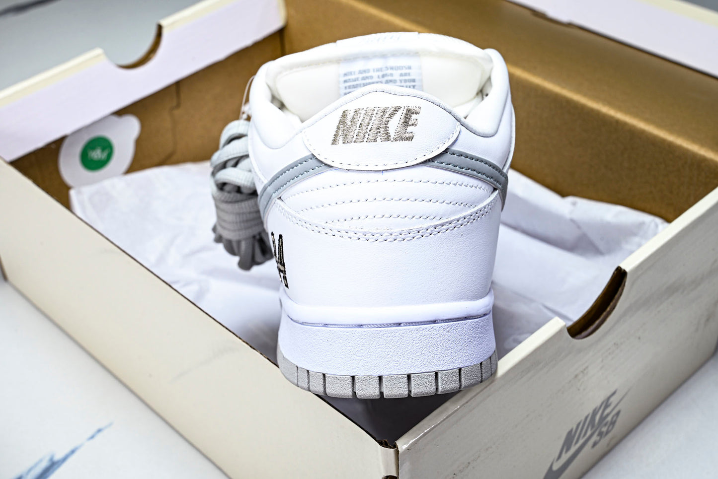 SB Dnk Low x Supreme 94 White Metallic Silver