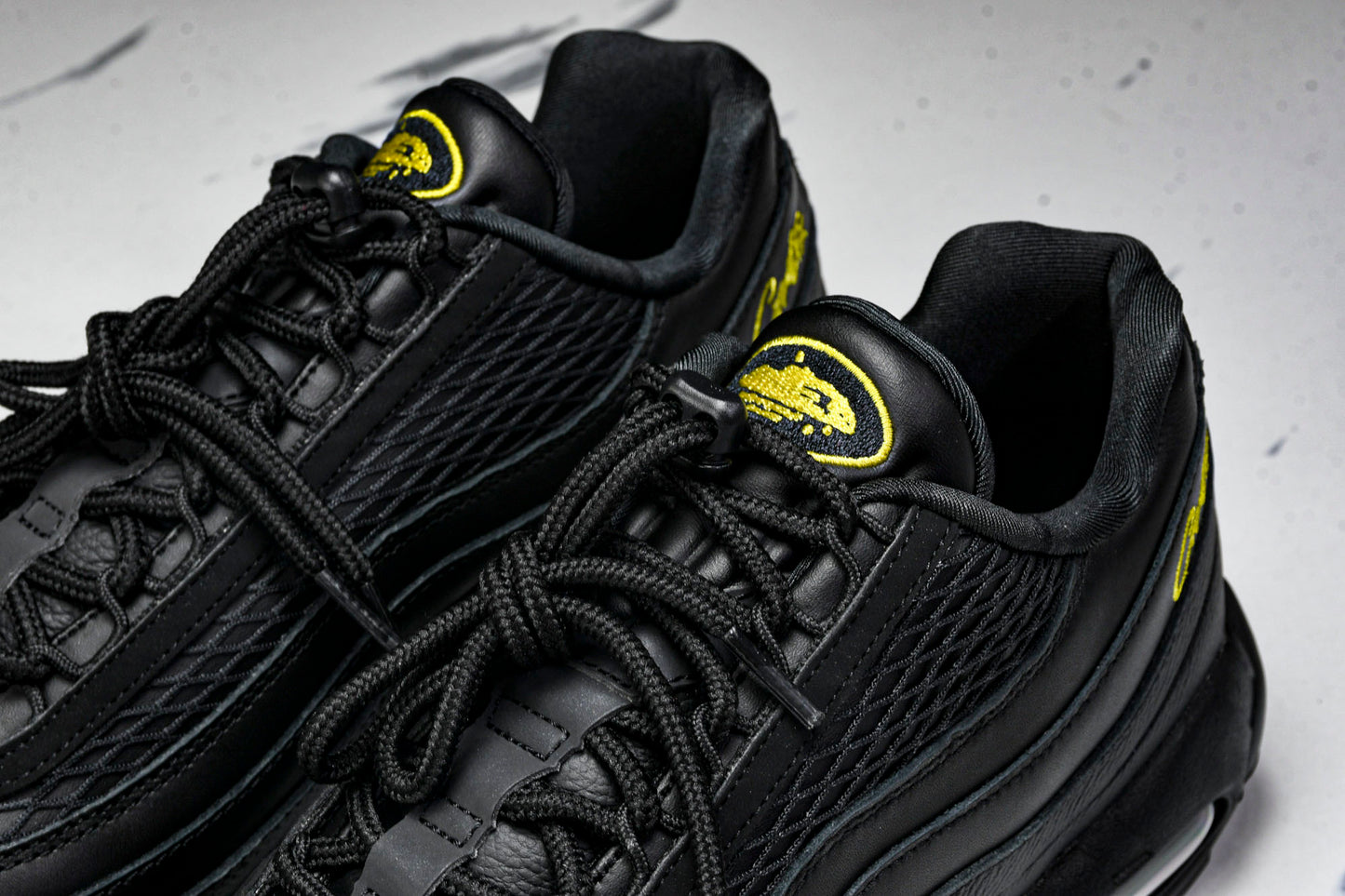 Corteiz x AM95 'Honey Black'