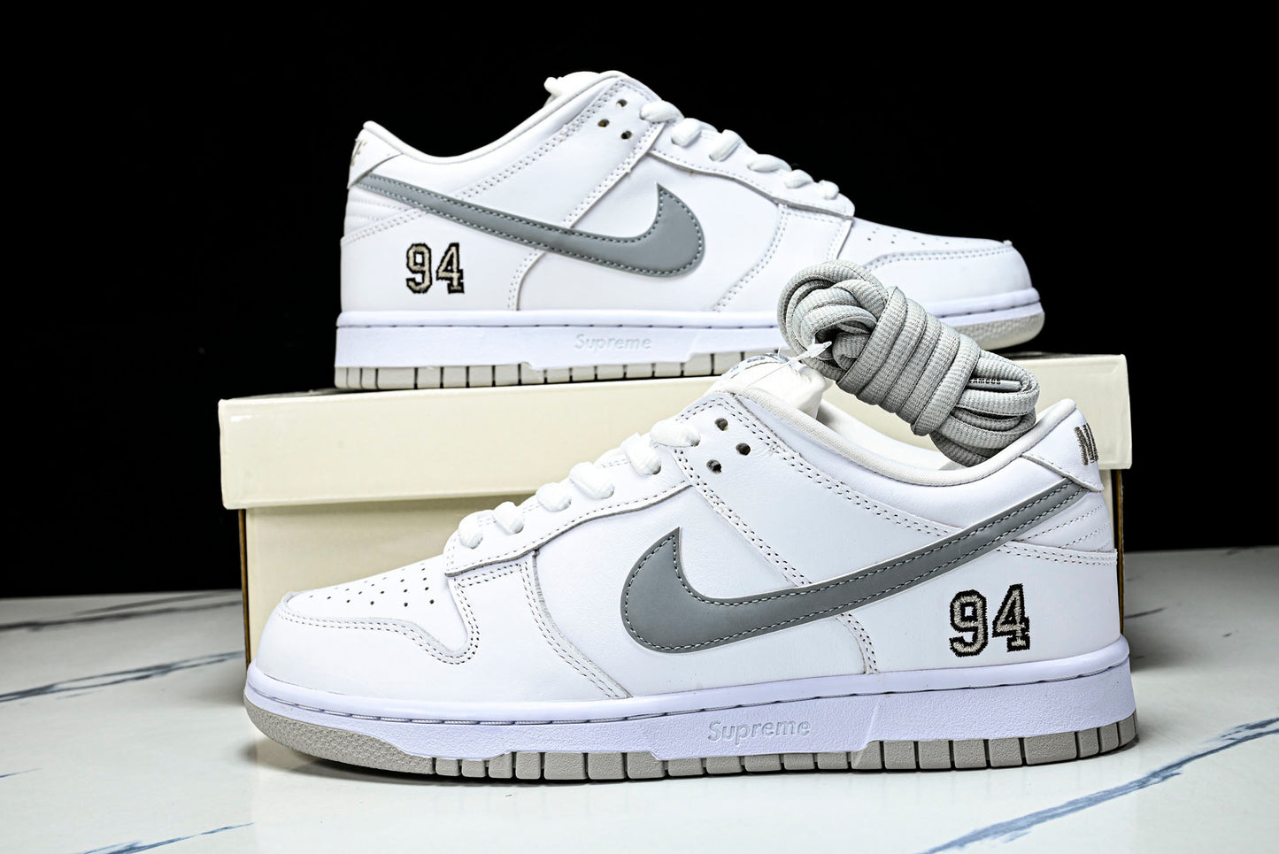 SB Dnk Low x Supreme 94 White Metallic Silver